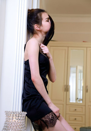 1 dark haired female tortures another during lezdom play in concrete cellar